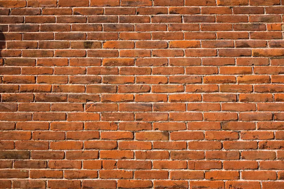 Red brick wall with straight, even mortar joints